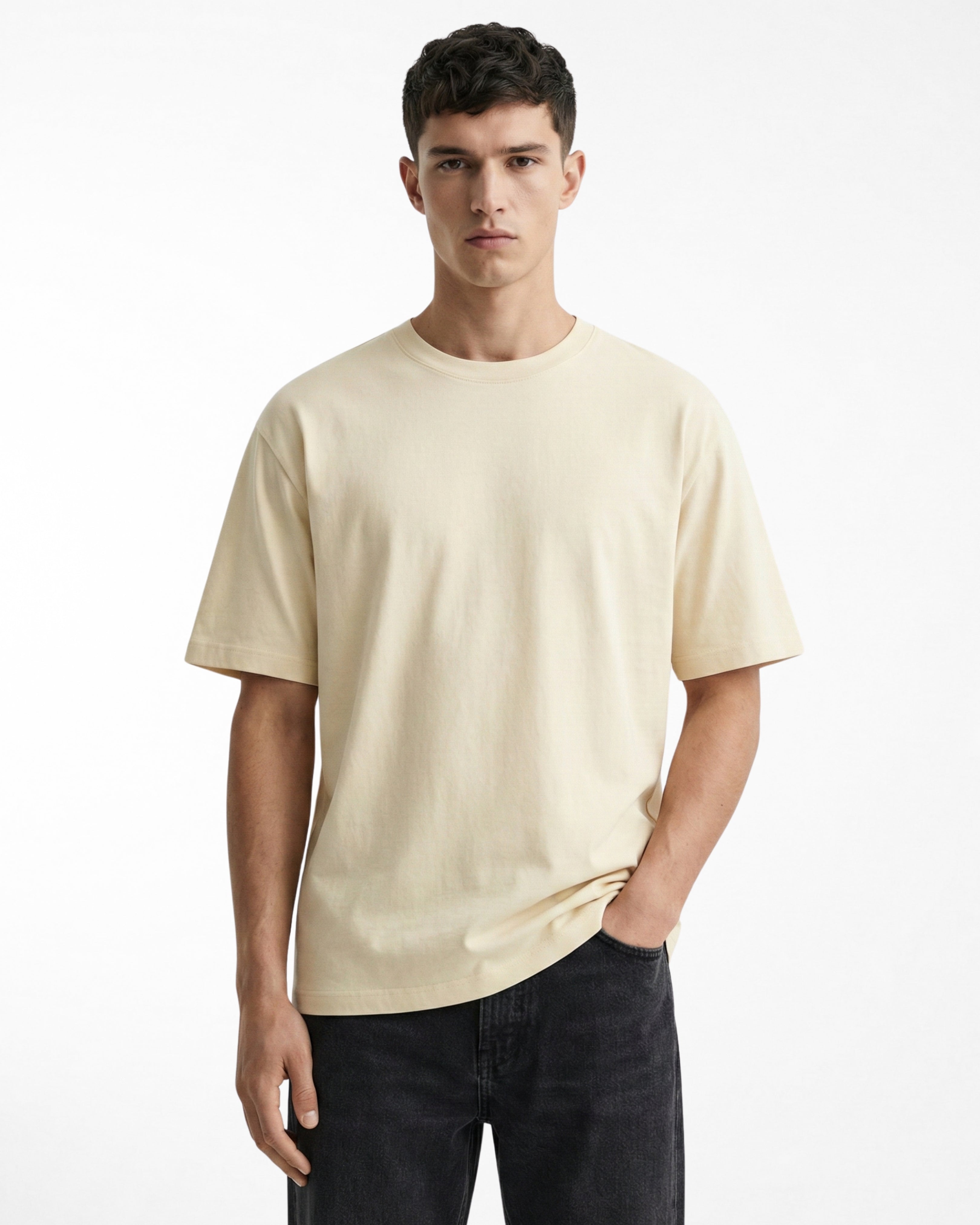 man wearing relaxed fit cream tshirt