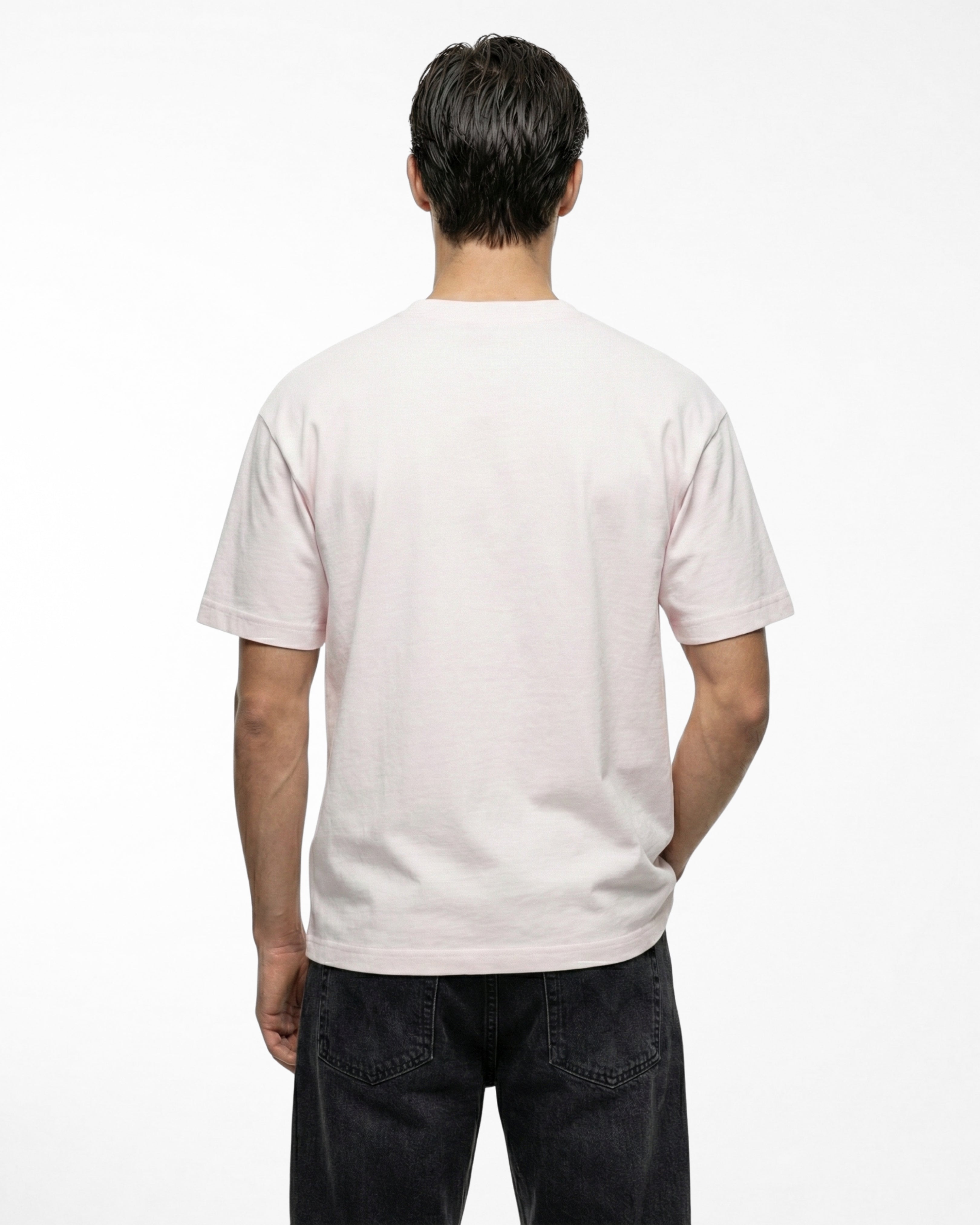 man wearing relaxed fit soft pink tshirt