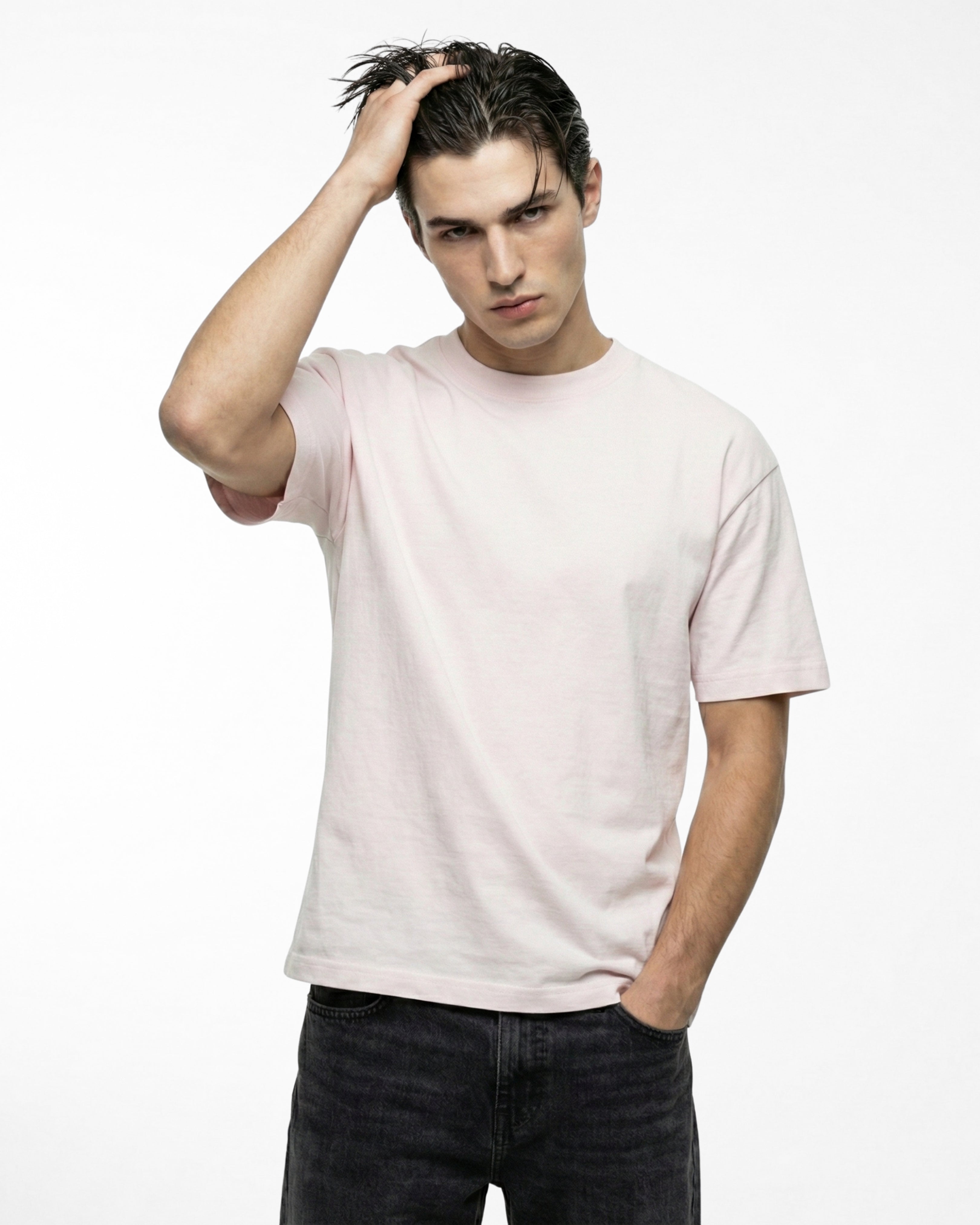 man wearing relaxed fit soft pink tshirt