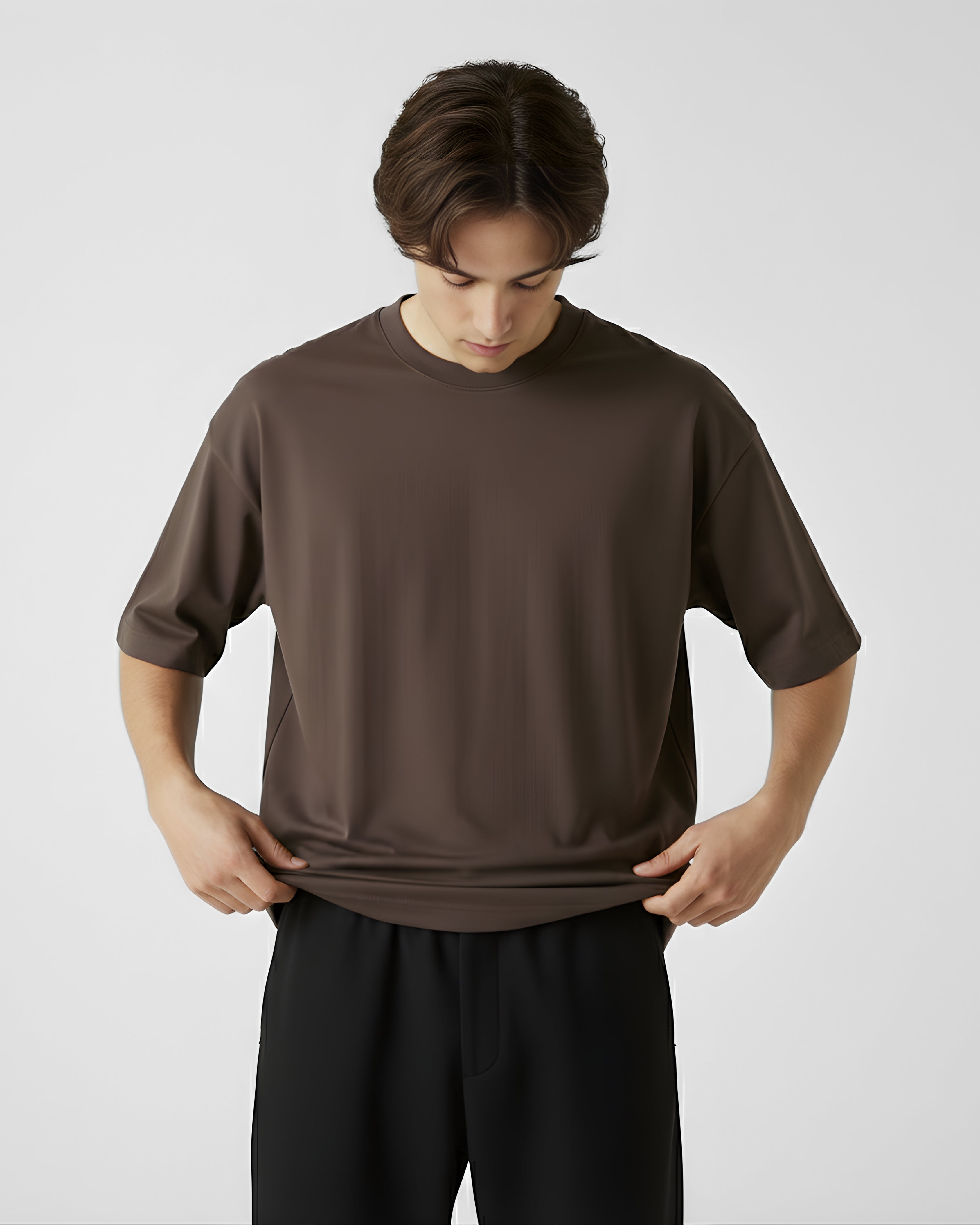 Person wearing a brown oversize t-shirt 