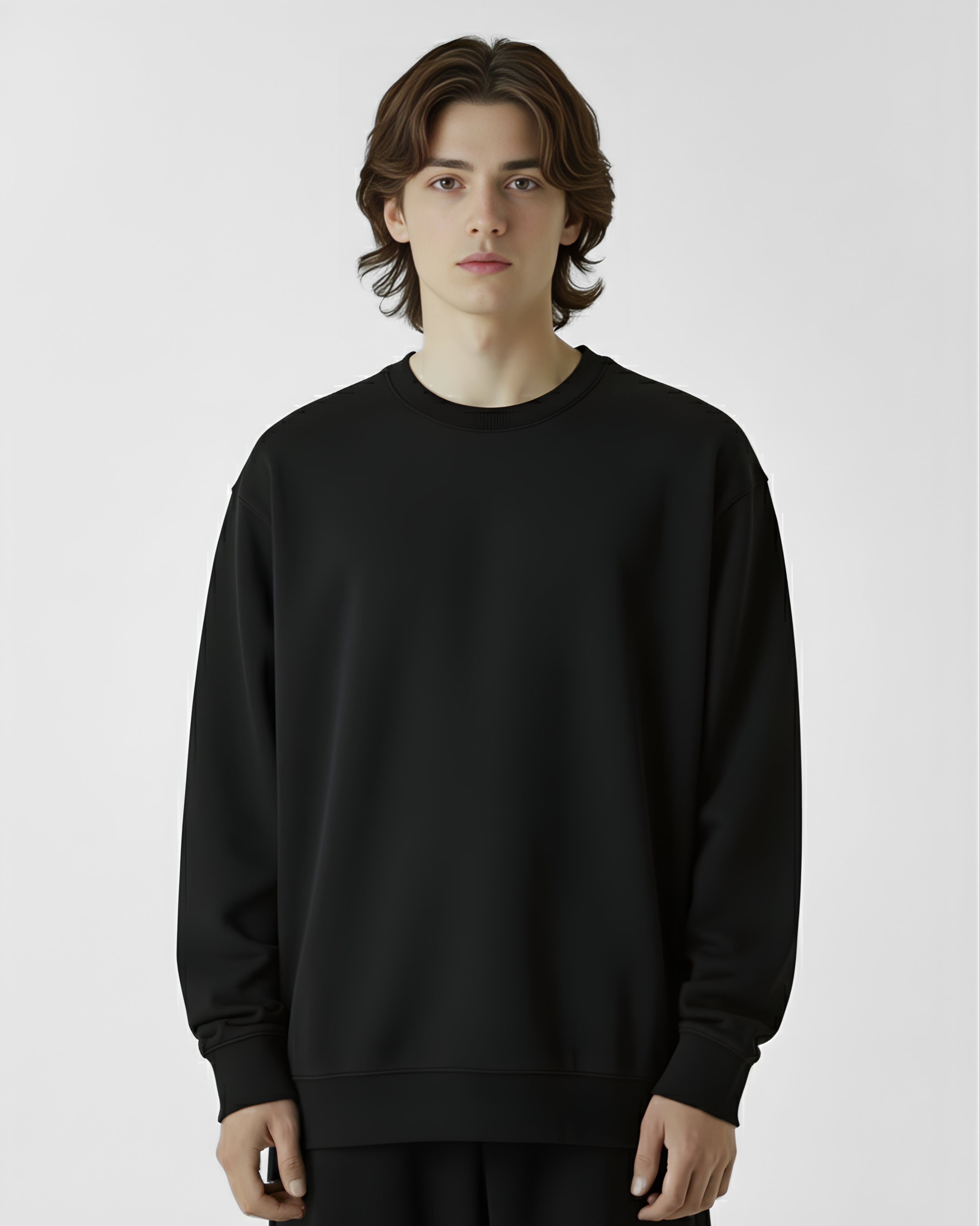 Person wearing a black sweatshirt on a plain background