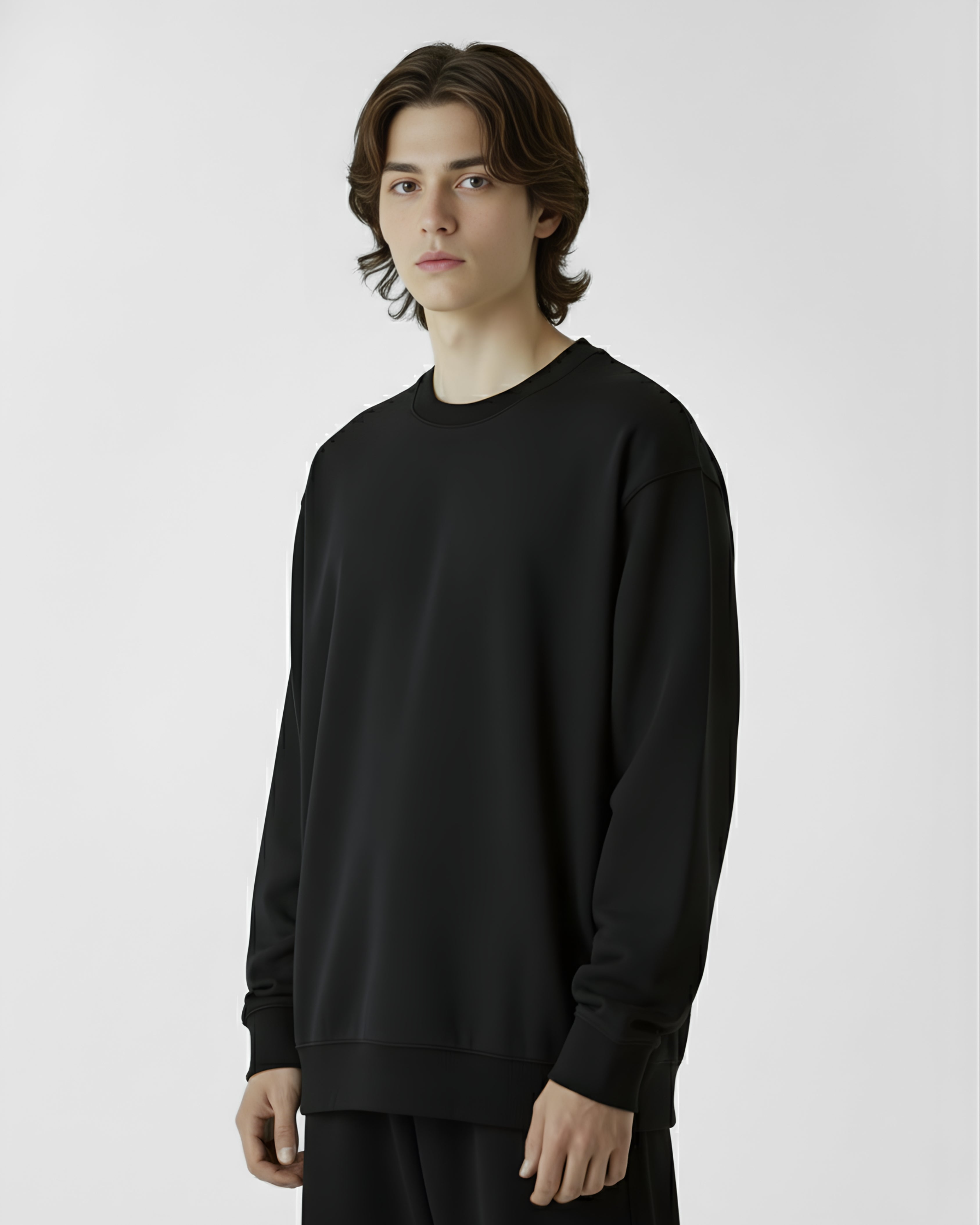 Person wearing a black long-sleeve shirt on a white background