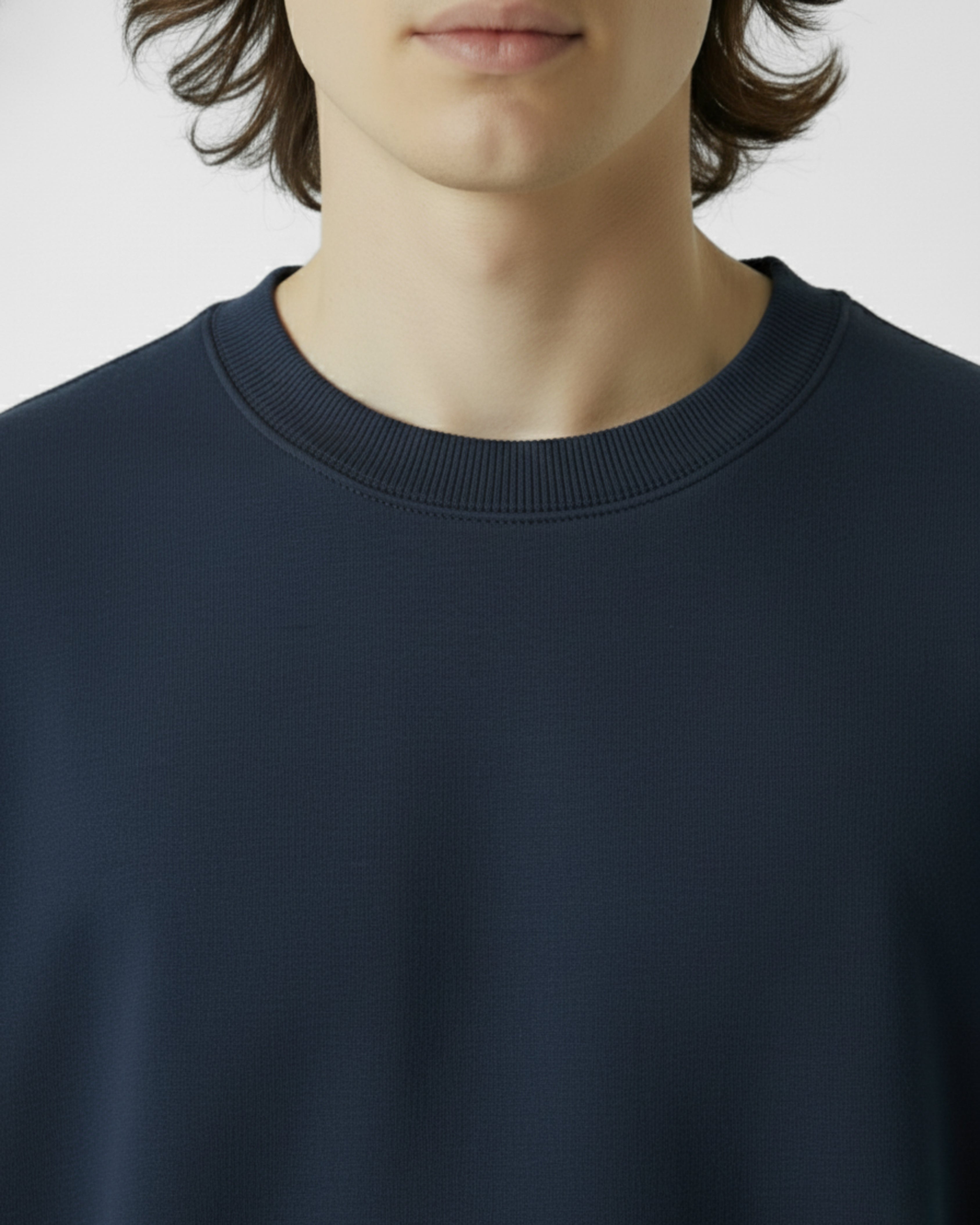 Navy blue sweatshirt worn by a person on a plain background